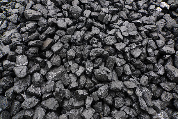 Pile of black coal pieces stock photo