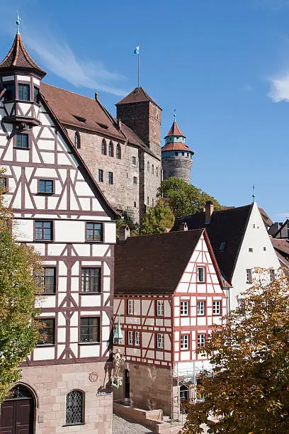 sight of nuremberg half-timbered houses with Kaiserburg-castle and Sinwellturm in background