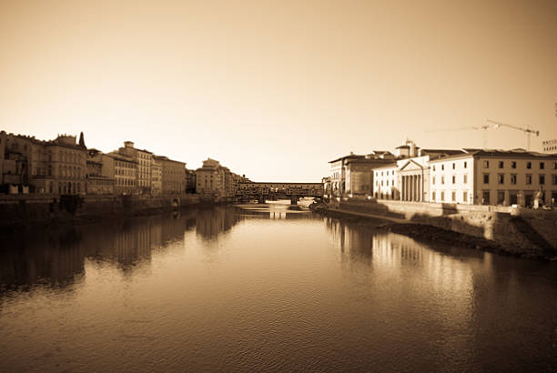 Cityscape of Florence, Italy with river Arno reflection. Uffizi Gallery. Sepia tone - retro monochrome color style.