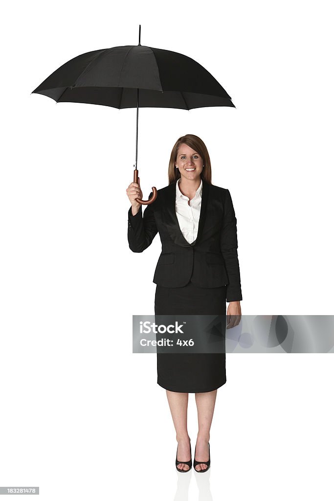 Donna d'affari sotto un ombrello - Foto stock royalty-free di Ombrello