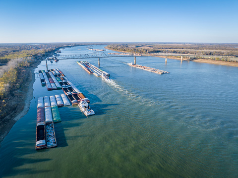 towboats and barges on the Ohio River above a confluence with the Mississippi at Cairo, Illinois, aerial view