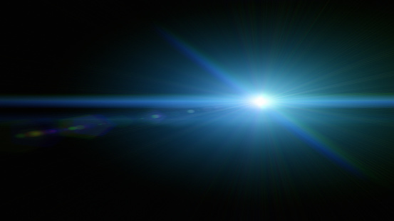 Blue lens flare overlay on black background design element