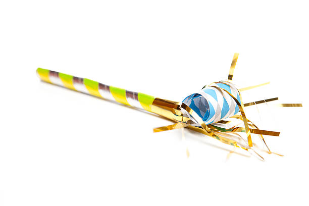 Party Time "Singele Yellow, Blue, Silver and Gold Party Blower Isolated on a White Background" party blower stock pictures, royalty-free photos & images