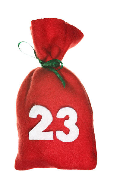 красный рождественский сумка для рождественский календарь изолирован на белом - advent calendar christmas christmas present sack стоковые фото и изображения