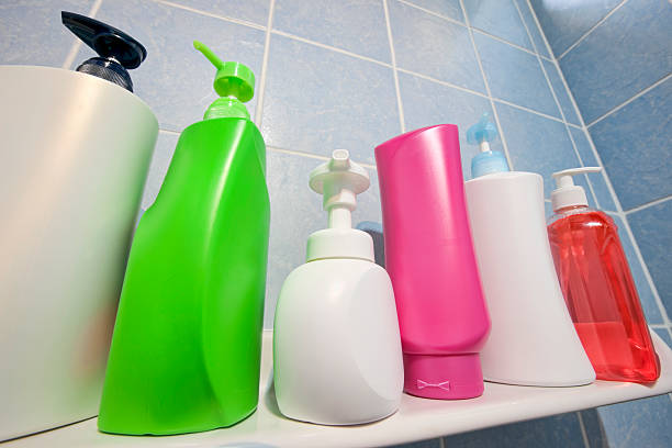 istock Many shampoo and soap bottles on a bathroom shelf. 183282464