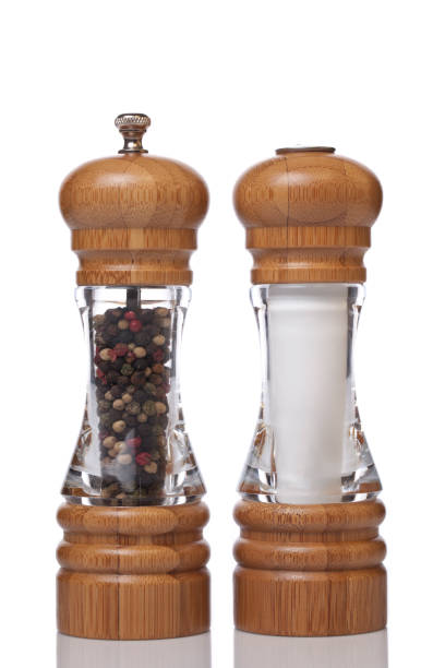 Salt and Pepper XXXL Wooden salt and pepper shakers isolated on white background. Studio shot pepper shaker stock pictures, royalty-free photos & images