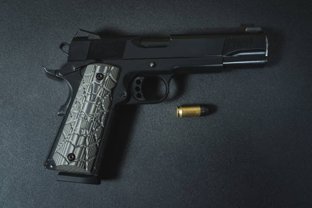 istock American m1911 45 caliber pistol close-up. 1832826763