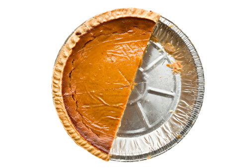 Overhead view of half of a pumpkin pie.