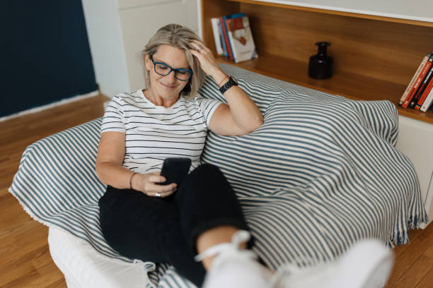 istock E-Commerce Elegance: Woman Smiling at a Purchase 1832828906
