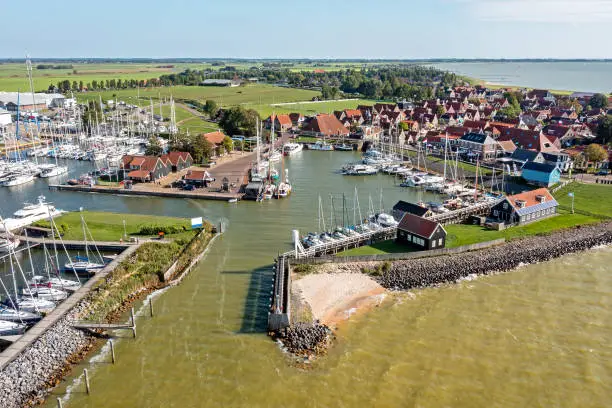 Photo of Aerial from the historical harbor and city Hindeloopen at the IJsselmeer in the Netherlands on a busy summer day