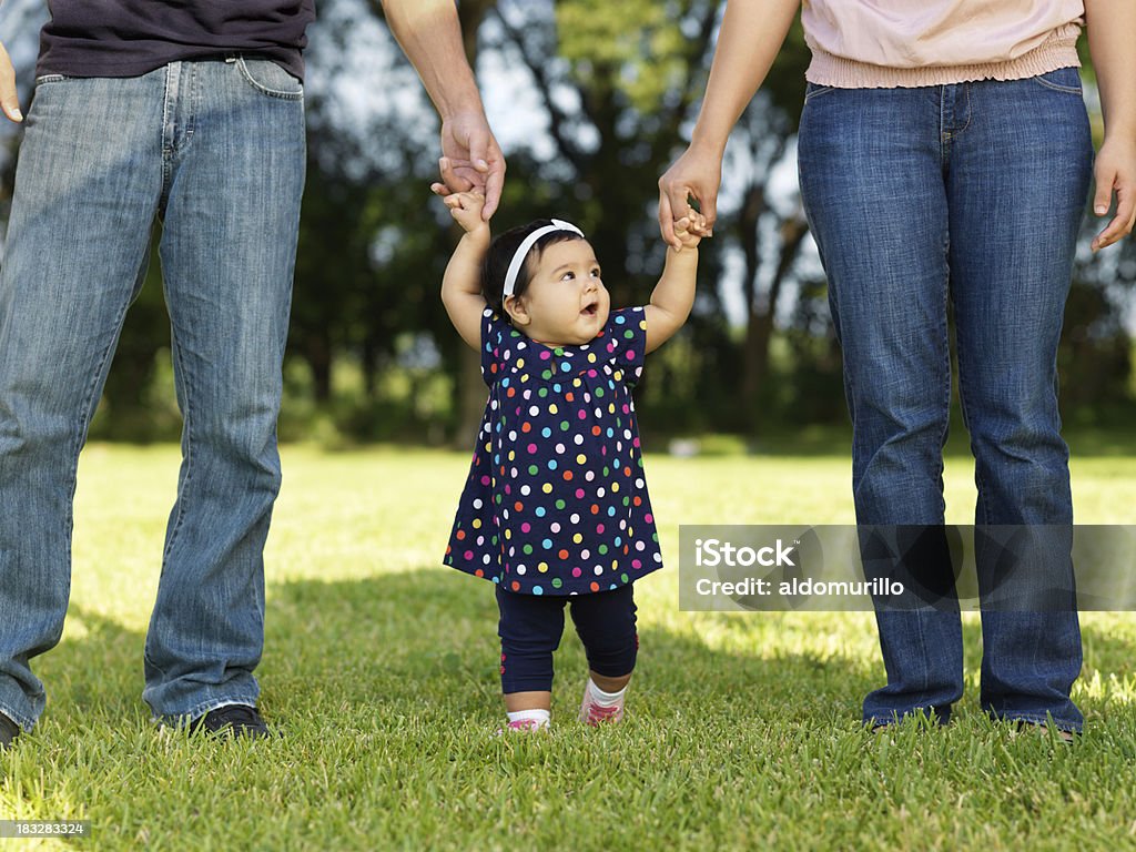 Baby Girl Walking With Her Parents Stock Photo - Download Image Now - Baby  - Human Age, Mother, Father - iStock