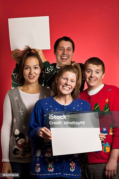 Dos Señales Jersey Navideño Grupo Foto de stock y más banco de imágenes de Suéter feo de Navidad - Suéter feo de Navidad, Grupo de personas, Navidad