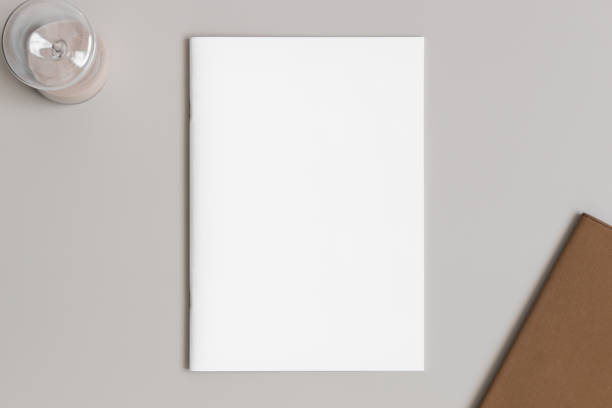 istock Magazine mockup with workspace accessories on the beige table. 1832836976