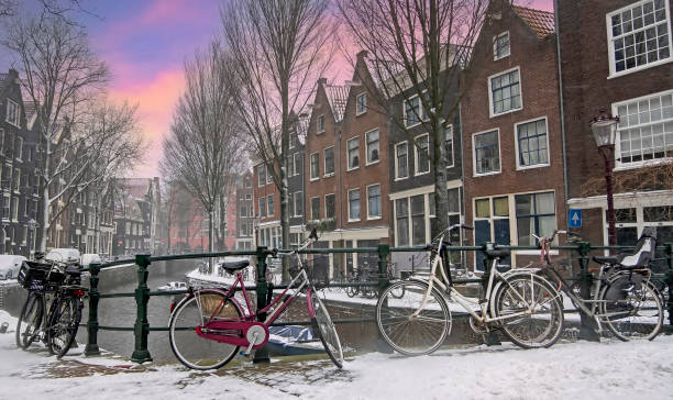 City scenic from snowy Amsterdam the Netherlands at sunset stock photo