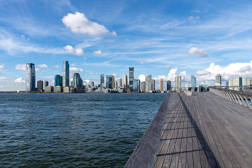 New York City, NY, USA-October 17, 2023; The Tide Deck of engineered rocky salt marsh on western edge of Pier 26 along the Hudson River with views on skyscrapers of Jersey City, New Jersey