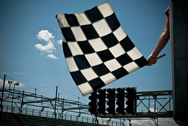 Waving Checkered Flag Waving the checkered flag. motorcycle racing stock pictures, royalty-free photos & images