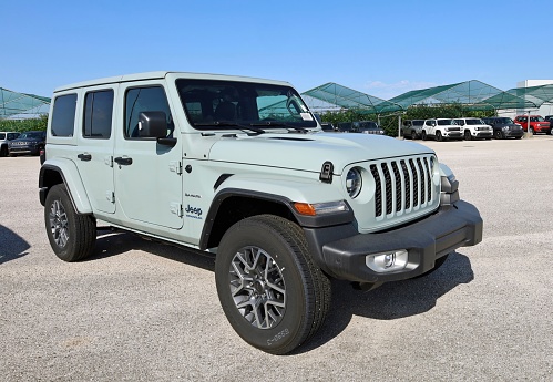 Reana del Rojale, Italy. August 13, 2023. Light blue Jeep Wrangler Sahara in show outside the official dealership