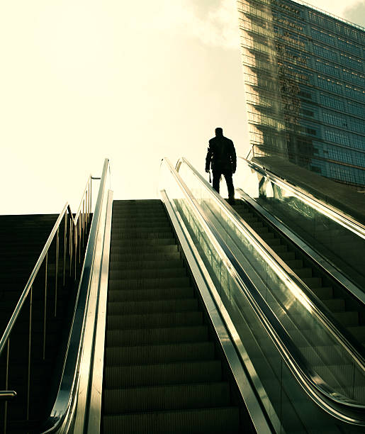 istock Business man on the escalator 183283911