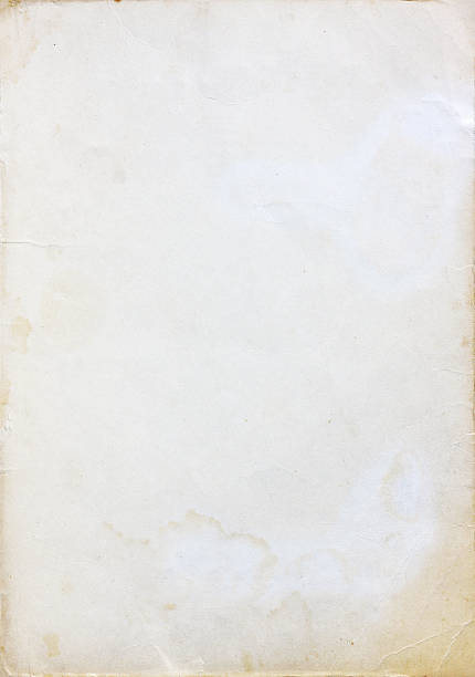 A cream colored old paper background stock photo