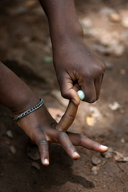 istock Girl is playing with marbles 183284419