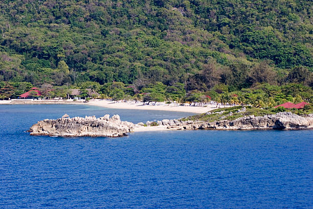 Tropical Coastline Rocky point and sandy beach - tropical paradise. labadee stock pictures, royalty-free photos & images