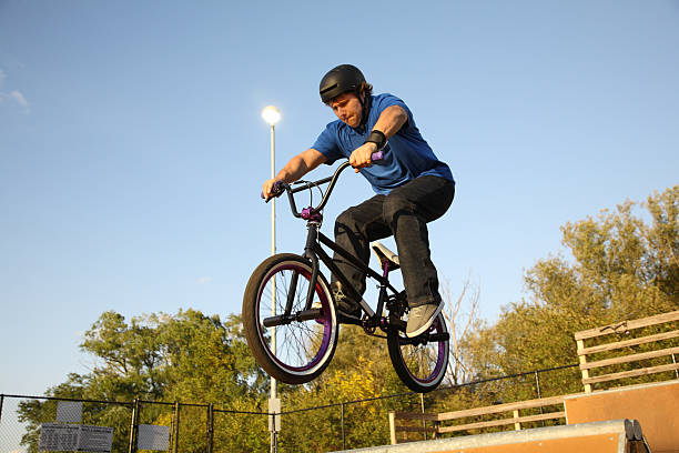 BMX Rider Going Over Spine stock photo