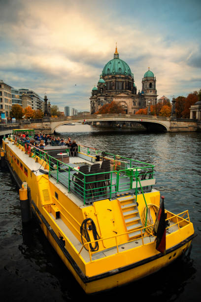 Berlin cityscape from Spree river with boat