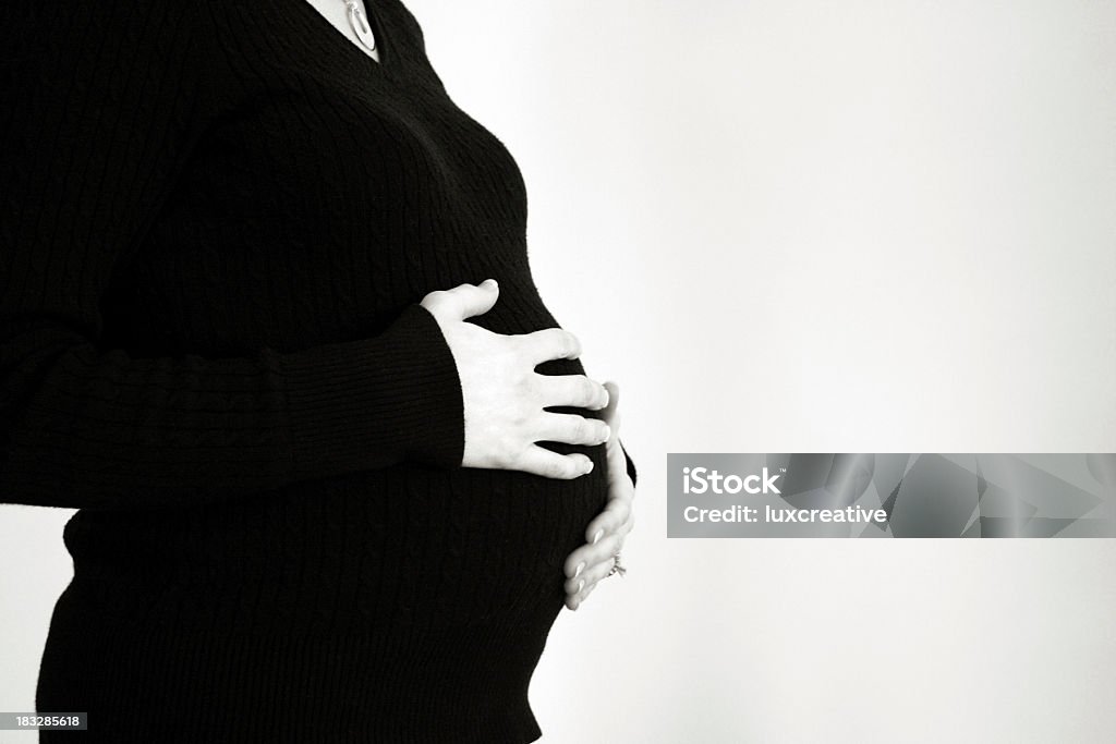 Mujer embarazada prever nacimiento - Foto de stock de Embarazada libre de derechos