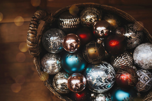 A basket filled with beautiful glass Christmas balls.