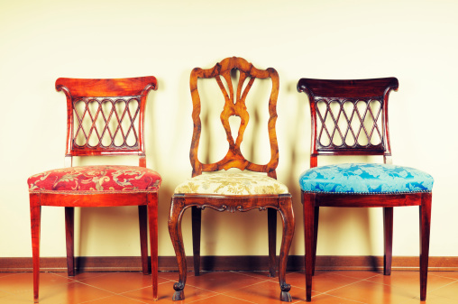 Three vintage chairs.Soft cross processing.