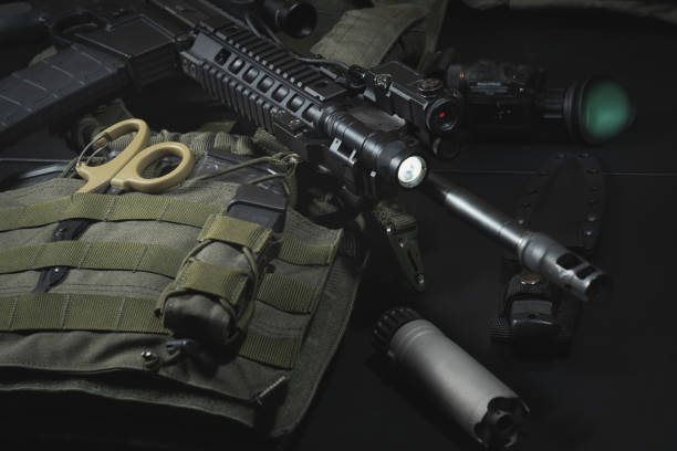 istock Tactical equipment, plate carrier, assault rifle with tactical flashlight, silencer and night vision device. 1832859006