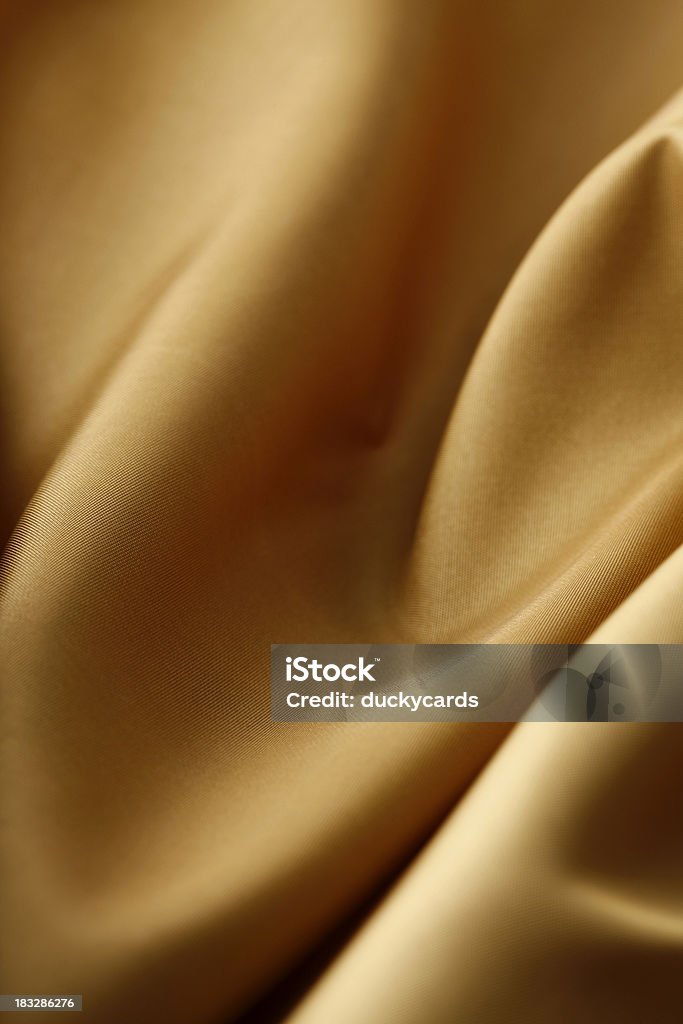金クロスの贅沢なテクスチャ背景 - カラー画像のロイヤリティフリーストックフォト