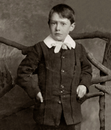 Antique photograph of a young boy from the Edwardian / Victorian period.