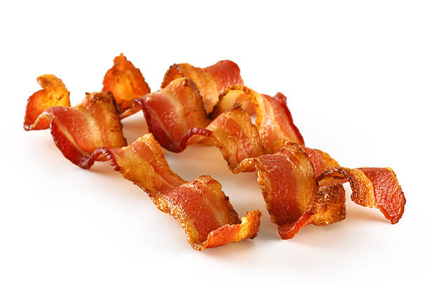 Three Bacon Slices on White "Three perfect, crispy, smokey slices of bacon; studio isolated on white.You need more bacon" bacon stock pictures, royalty-free photos & images