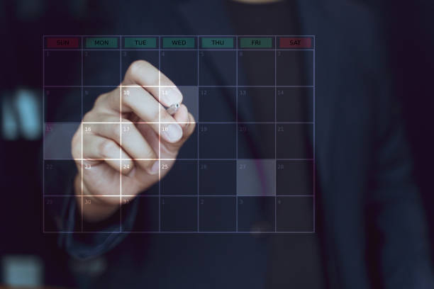 istock Business Planning and Schedule Plan table on screen with people working on desk. Business people set plan and schedule meeting. 1832874084