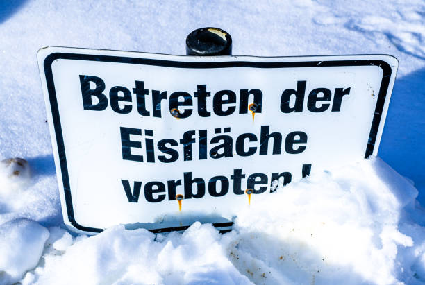 warning sign in german - translation: entering the ice surface is prohibited - eisfläche imagens e fotografias de stock