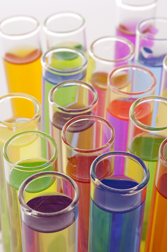 Closeup view of test tubes filled with multicolored liquids