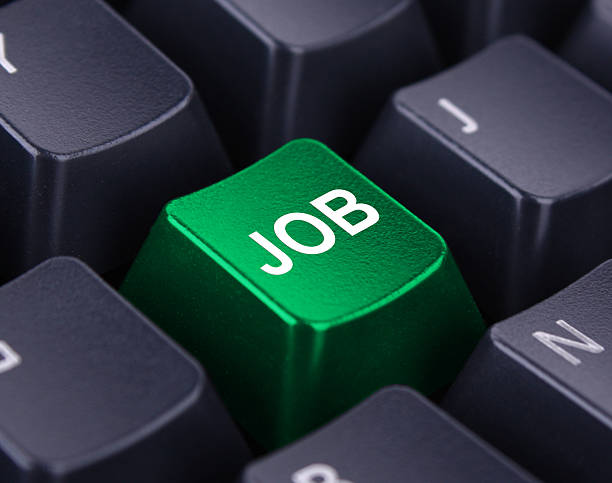 istock Black keyboard with a green job key 183288414
