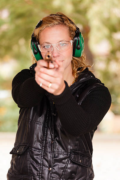 istock Woman Pointing a Gun 183288803