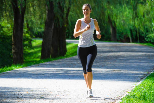 istock Woman running in a city park for exercise 183288983