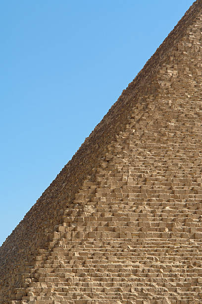 Pyramid of Cheops Detail "Detail of Great Pyramid of Cheops in Cairo (Giza) Egypt. Blue sky in background, morning light. Foto: April 2006." pyramid giza pyramids close up egypt stock pictures, royalty-free photos & images