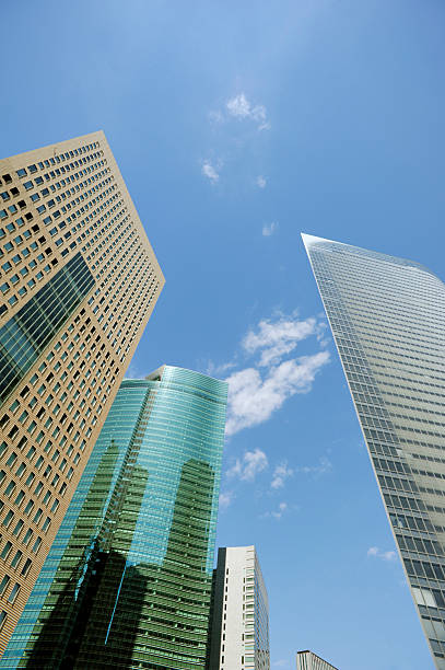 moderni grattacieli in una giornata di sole - shimbashi district skyscraper building exterior low angle view foto e immagini stock