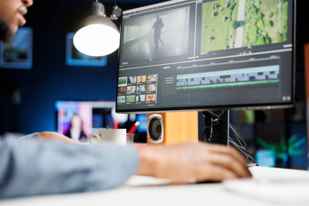 istock Videographer editing contrast and exposure on montage 1832895979
