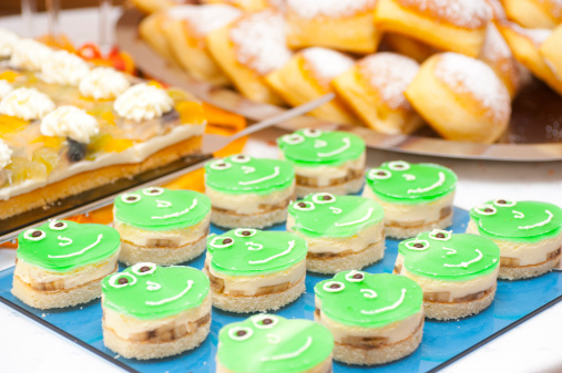 cake formed as frog on catering buffet