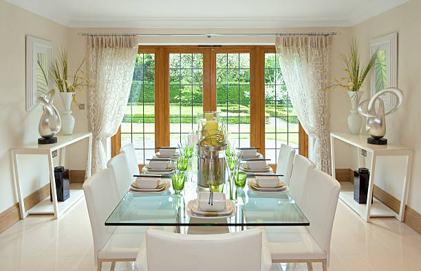 bright dining room with garden view "a light and airy dining room with a lovely garden view in a luxury expensive new home. Prepared as a show home by a leading Interior Designer, the decor is contemporary and the table is set for an oriental lunch or dinner with bowls and chopsticks. Looking for a Kitchen, Dining Room or dining related image Then please see my other images by clicking on the Lightbox link below..." curtain rail stock pictures, royalty-free photos & images