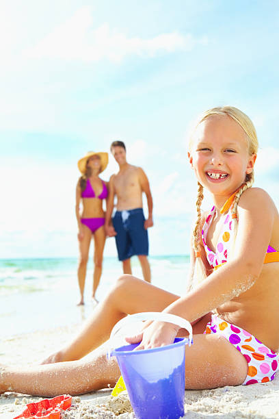 istock Girl playing in the sand 183290054
