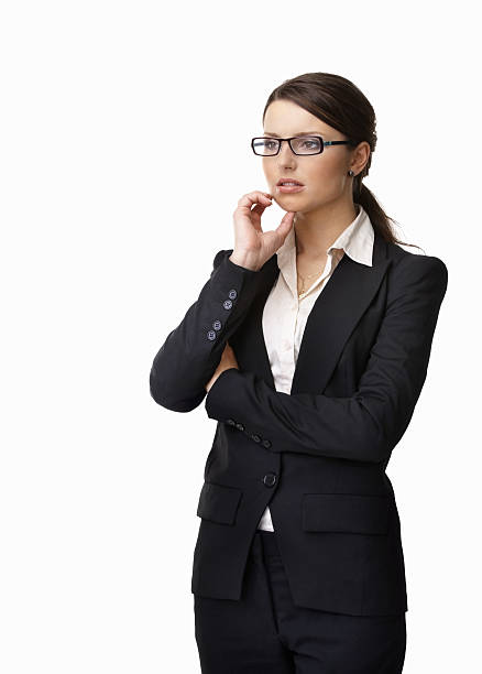 istock Thoughtful young business woman wearing spectacles against white 183290611