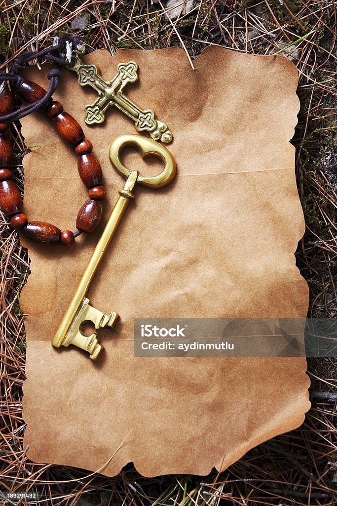 Message from god Oold cross and key on old paper. Antique Stock Photo