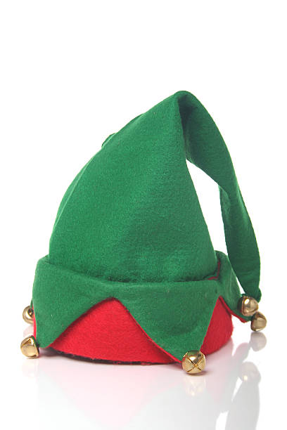 Green and red elf hat with bells with a white background stock photo