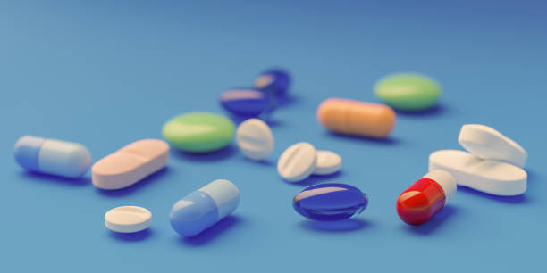 istock Pile of medications on blue background 1832921698